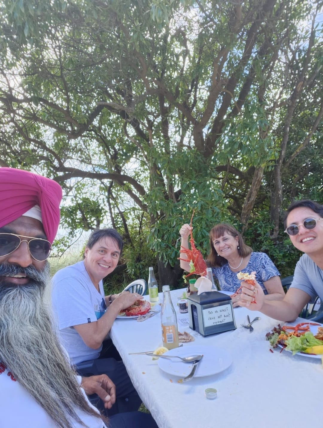Mr Singh and customers enjoying a meal together