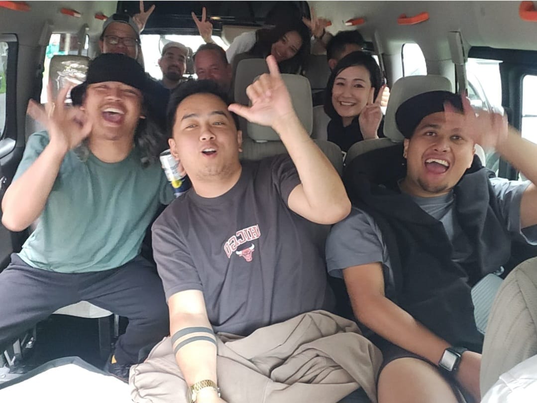 Happy group of passengers inside the van